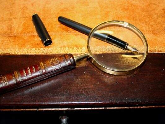 Magnifying Glass On Antique Table